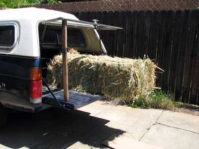 hay bale at the edge of a pickup